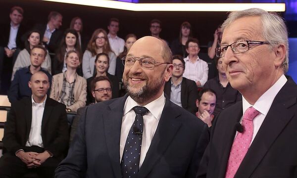 European People's Party candidate as President of the European Commission Juncker and his counterpart from the Party of the European Socialists Schulz pose for media before a live television discussion at ZDF in Berlin