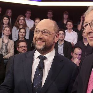 European People's Party candidate as President of the European Commission Juncker and his counterpart from the Party of the European Socialists Schulz pose for media before a live television discussion at ZDF in Berlin