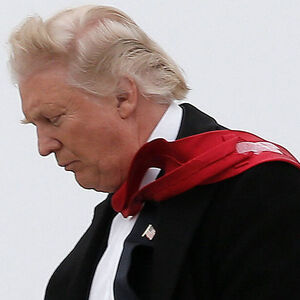 U.S. President-elect Donald Trump walks off his plane upon his arrival in Indianapolis