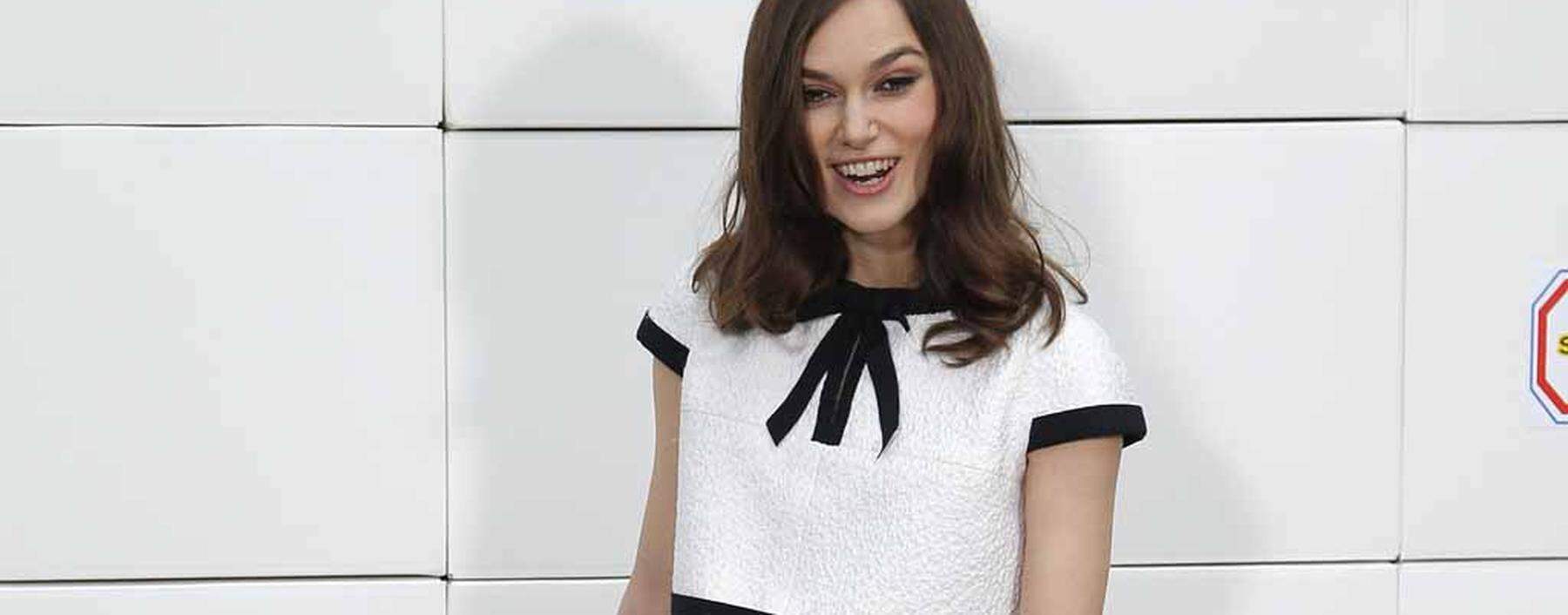 Actress Keira Knightley poses before the German designer Karl Lagerfeld Fall/Winter 2014-2015 women´s ready-to-wear collection show for French fashion house Chanel during Paris Fashion Week