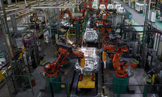 FILE PHOTO -  Robots assemble Renault and Nissan automobiles on the production line at the Renault SA car factory in Flins