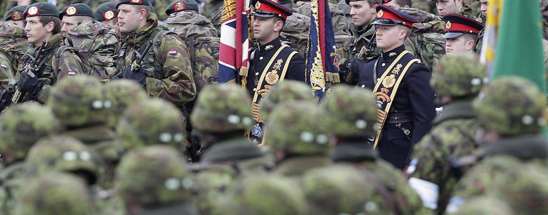 Netherland's and British soldiers attend military parade celebrating Estonia's Independence Day near border crossing with Russia in Narva