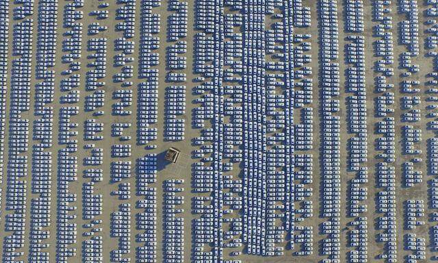 An aerial view shows new Audi cars in an open-air parking lot in Changchun