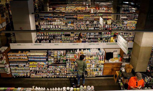 Customers shop at a Whole Foods store in New York