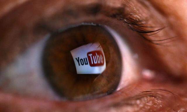 A picture illustration shows a YouTube logo reflected in a person's eye, in central Bosnian town of Zenica