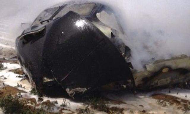 Part of an Airbus A400M is pictured after it crashed in a field near the Andalusian capital of Seville