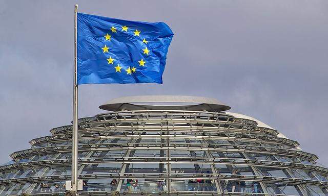 The European Union flag is seen above the cupola of the Reichstag building, the seat of the Bundestag, the German lower house of parliament, in Berlin