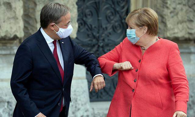 FILE PHOTO: German Chancellor Merkel meets Armin Laschet in Duesseldorf