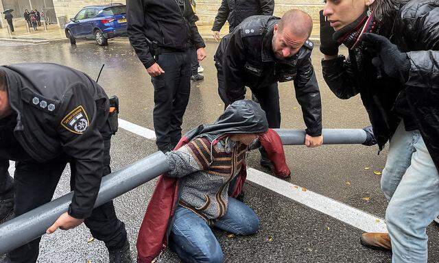 Protesters block the road leading to Israeli Prime Minister Benjamin Netanyahu's office as his nationalist coalition government presses on with its contentious judicial overhaul, in Jerusalem