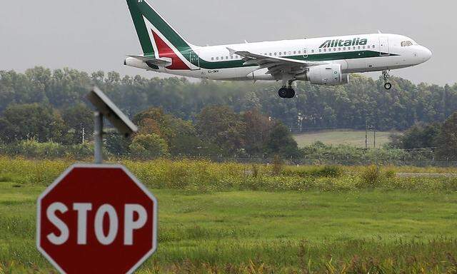 An Alitalia plane lands at Fiumicino international airport in Rome