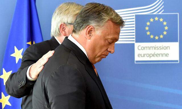 Hungary´s PM Orban is welcomed by EC President Juncker ahead of their meeting at the European Commission headquarters in Brussels