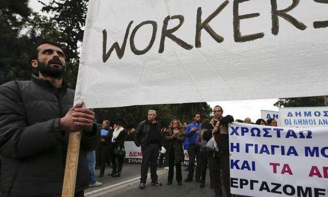 Municipal workers take part in a protest against austerity measures outside the Administrative Reform ministry in Athens