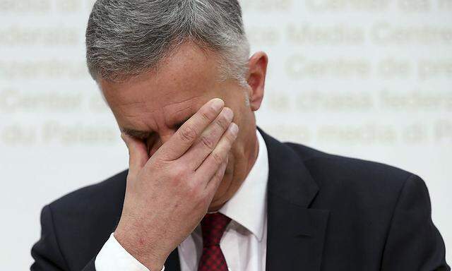 Swiss President and Foreign Minister Burkhalter reacts during a news conference in Bern
