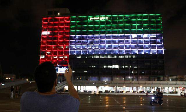 Tel Aviv's municipality building is lit in the Israeli and United Arab Emirates national flags following the announcement of a deal to normalise relations between the countries