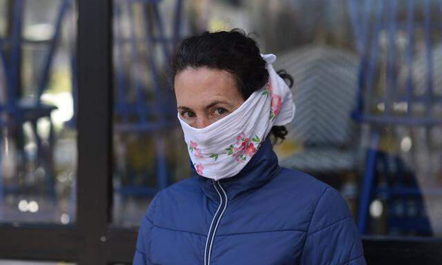 Daily life in Paris during coronavirus lockdown April 05, 2020 - Paris, France: Portrait of a woman with a protection ho