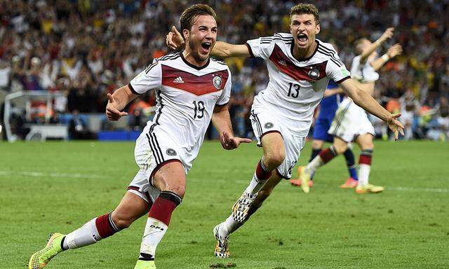 Germany´s Goetze celebrates near Mueller after scoring a goal during extra time in their 2014 World Cup final against Argentina at the Maracana stadium in Rio de Janeiro