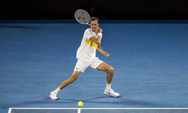 MELBOURNE, VIC - FEBRUARY 19: Daniil Medvedev of Russia returns the ball during the semifinals of the 2021 Australian O