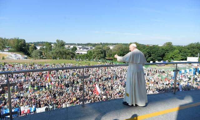 Pope Francis waves as he arrives to the Sanctuary of Divine Mercy in Krakow