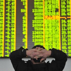 HANGZHOU CHINA JANUARY 26 CHINA OUT An investor watches the electronic board at a stock exchan