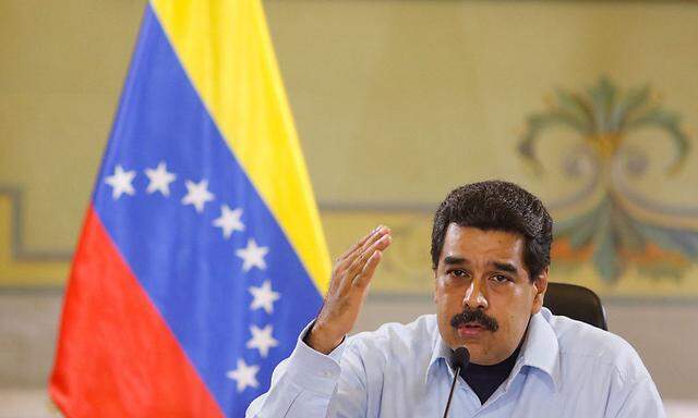 Venezuela's President Nicolas Maduro speaks during a meeting with ministers at the Miraflores Palace in Caracas