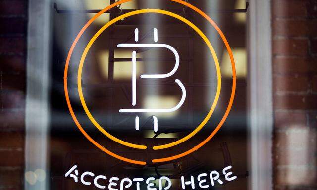 FILE PHOTO: A Bitcoin sign is seen in a window in Toronto