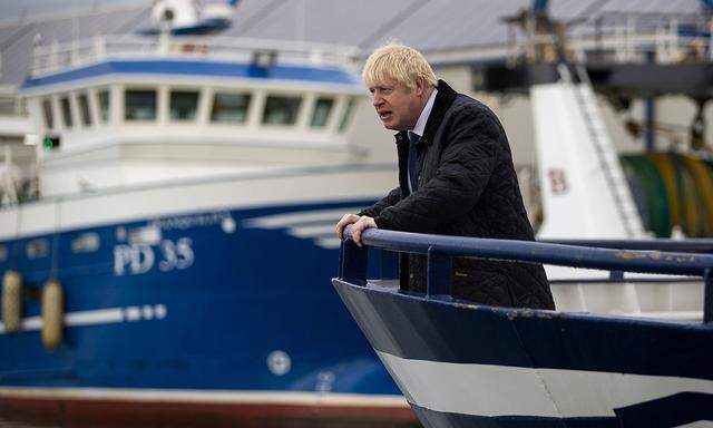 FILE PHOTO: Britain's Prime Minister Boris Johnson is seen aboard the Opportunus IV fishing trawler in Peterhead