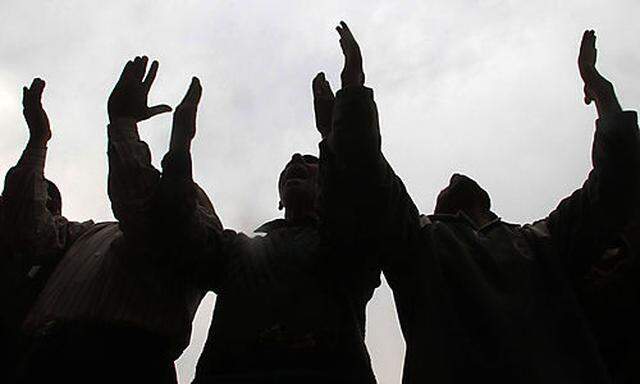 Protesters gesture during a demonstration in Tahrir Square in Cairo, Egypt, Friday, Dec. 30, 2011. Se