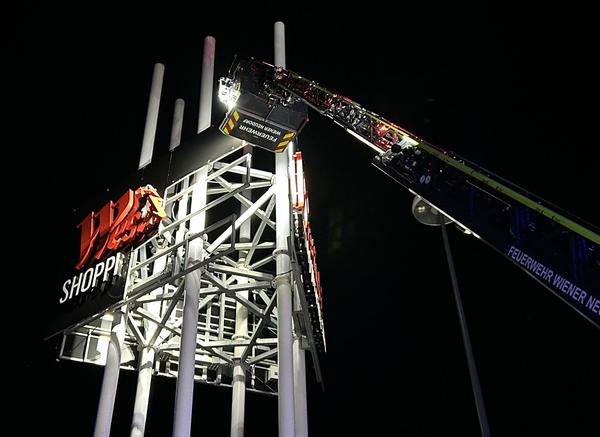 Fire brigade action on a billboard in Westfield Shopping City. 