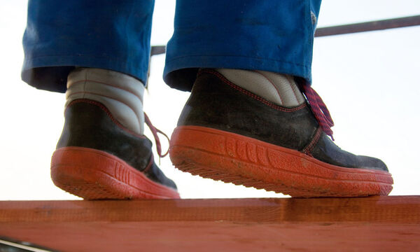  Workman standing on a scaffolding