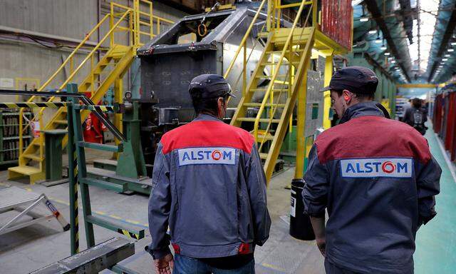 FILE PHOTO: Employees work at the Alstom high-speed train TGV factory in Belfort