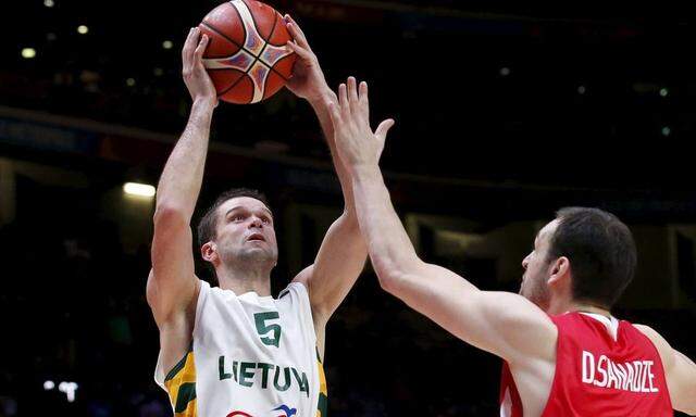 Lithuania's Kalnietis goes for the basket against Georgia's Sanadze during their 2015 EuroBasket 2015 round of 16 match at the Pierre Mauroy stadium in Villeneuve d'Ascq