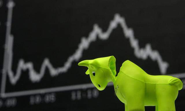 File photo of a bull styrofoam figure pictured in front of the DAX board at the Frankfurt stock exchange
