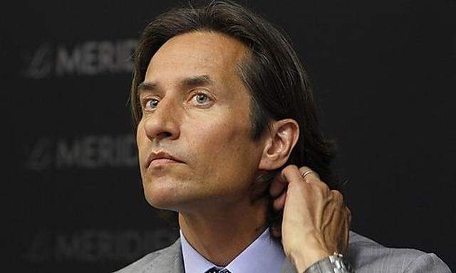 Former Austrian Finance Minister Grasser gestures during news conference in Vienna