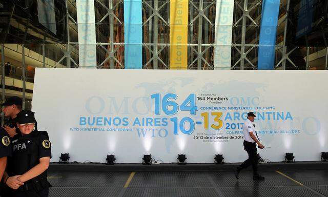 Argentine police officers stand at the headquarters of the 11th World Trade Organization's ministerial conference in Buenos Aires