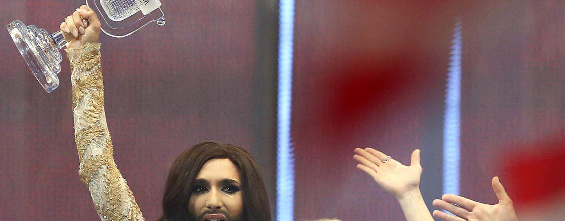 Conchita Wurst representing Austria celebrates after winning the grand final of the 59th Eurovision Song Contest in Copenhagen