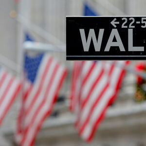 FILE PHOTO: A street sign for Wall Street is seen outside the New York Stock Exchange in New York City