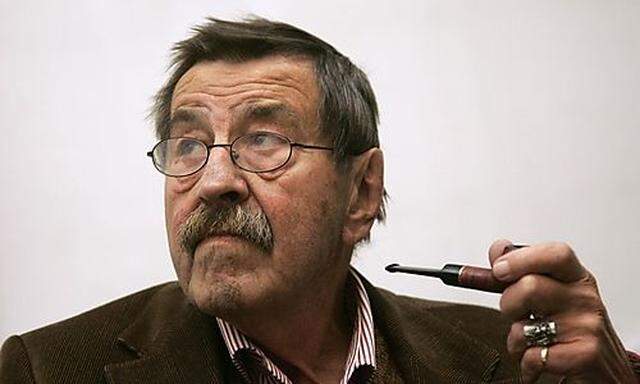 File photo of novelist Grass smoking pipe before the opening of an exhibition in Hamburg