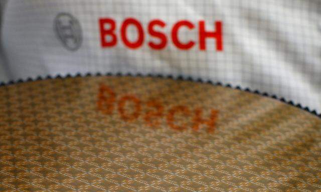 Bosch logo is reflected in semiconductor wafer in company manufacturing base in Reutlingen