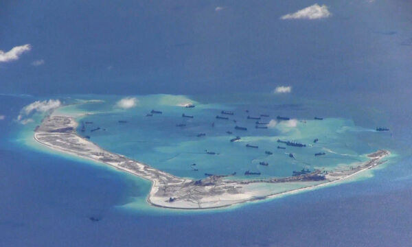 Still image from United States Navy video purportedly shows Chinese dredging vessels in the waters around Mischief Reef in the disputed Spratly Islands