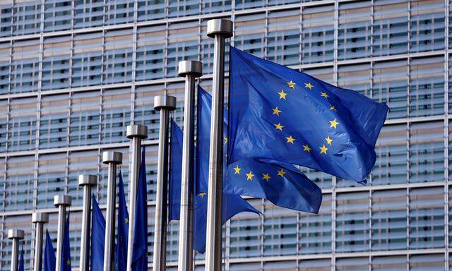 EU flags flutter outside the EU Commission headquarters in Brussels