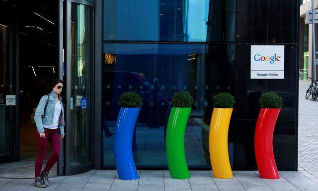 FILE PHOTO: A woman walks past the Google offices near the city centre in Dublin