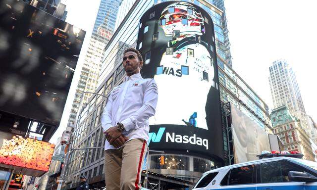 Formula One World Champion Mercedes' Lewis Hamilton stands outside the Nasdaq Market Site in New York City