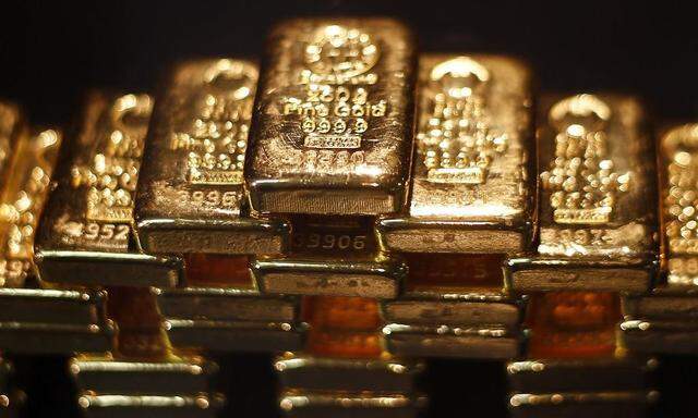Gold bars are stacked at a safe deposit room of the ProAurum gold house in Munich