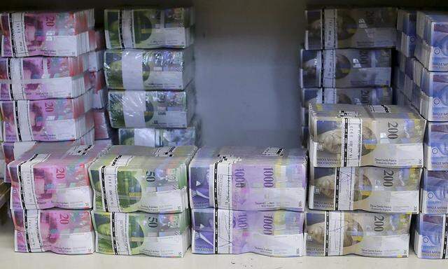 File photo of wads of Swiss franc banknotes at the GSA Austria company's headquarters in Vienna
