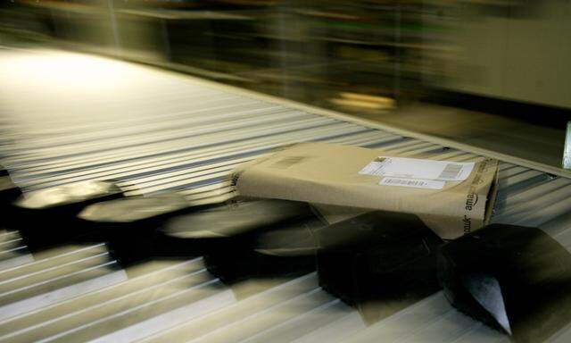 Parcels move along a conveyor belt in the Amazon.co.uk warehouse in Milton Keynes, north of London