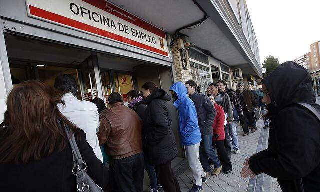 People enter a government-run employment office in Madrid