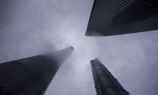 Skyscrapers Shanghai Tower, Shanghai World Financial Center and Jin Mao Tower are seen at the financial district of Pudong in Shanghai