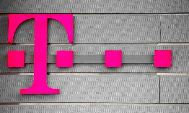 FILE PHOTO: A logo of Germany's telecommunications giant Deutsche Telekom AG is seen before the company's annual news conference in Bonn