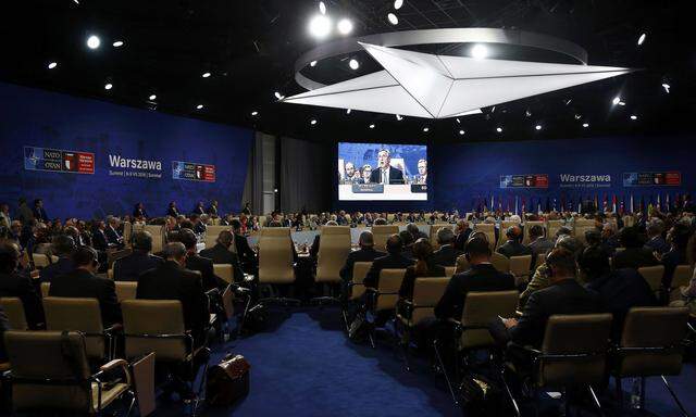 Participants attend the NATO Summit in Warsaw