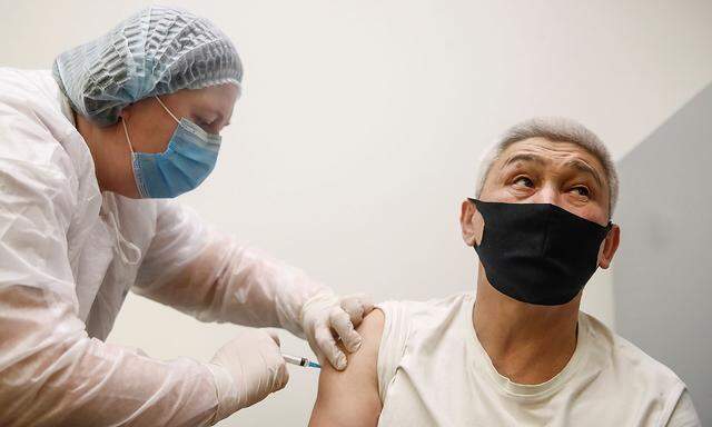 A man receives an injection with Sputnik V (Gam-COVID-Vac) vaccine against the coronavirus disease (COVID-19) in Moscow